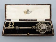 A hallmarked silver presentation key engraved with Leyton Urban District Council presented on the