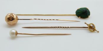 A Victorian stick pin set with a scarab beetle,