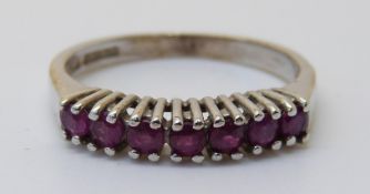 A 9ct white gold ring set with rubies (size M)