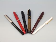 Six fountain pens to include Osmiroid, two Swan examples with 14k gold nibs,