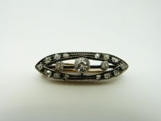 A Victorian brooch set with a large old cut diamond, measuring approximately 0.