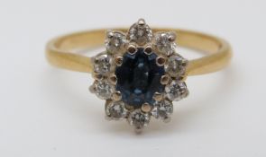 An 18ct gold ring set with an oval sapphire of approximately 0.