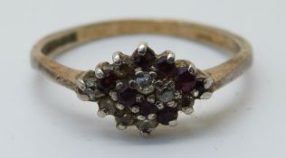 An 9ct gold ring set with rubies and diamonds (size R)