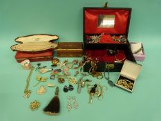 A large collection of costume jewellery to include agate earrings, figural necklace,