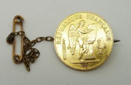 A mounted French gold coin, 7.