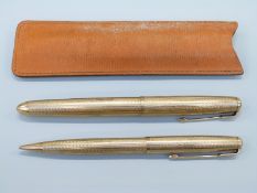 A hallmarked 9ct gold Parker 51 fountain pen and propelling pencil set