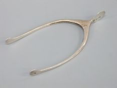 A pair of novelty hallmarked silver sugar nips in the form of a wishbone, Birmingham 1928,