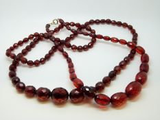 Two Bakelite cherry amber style faceted beaded necklaces.