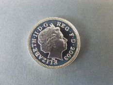 A 2003 silver proof cased £1 coin with certificate