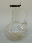 A Victorian etched glass hallmarked silver mounted claret jug,