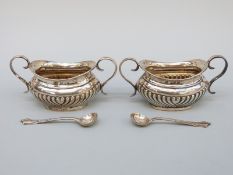 A pair of George V hallmarked silver twin handled open salts, Chester 1912/15, length 10cm,