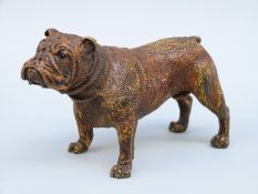 A bronze bulldog figure with Geschutzt mark to underside,