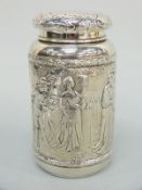 A German silver tea caddy with import marks for Chester 1905 and relief moulded decoration of