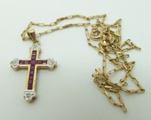 A 9ct gold chain made up of rectangular links with an 9ct gold cross pendant set with rubies and