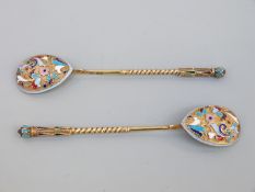 A pair of Russian silver spoons with a gilt finish, decorated with cloisonné enamel ,