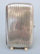 A George V hallmarked silver cigarette case with engine turned decoration, Birmingham 1935,