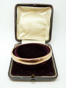 A 9ct rose gold bangle in original case, 14.