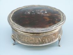 A George V hallmarked silver tortoiseshell lidded dressing table pot, Birmingham 1926,