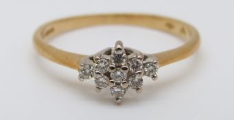 An 18ct gold ring set with diamonds in a cluster, 2.