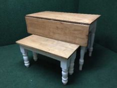 A reclaimed pine flat sided kitchen table and two benches