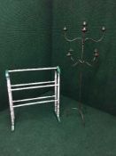 A painted pine towel rail and a metal nine way floor standing candle holder