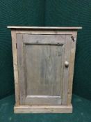 A reclaimed pine small cupboard