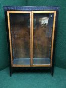 A glazed double door bookcase