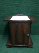 A continental oak bedside cabinet inset marble top