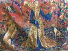 An early 20th century hanging tapestry depicting lady in a garden