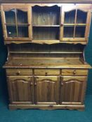 A pine triple door kitchen dresser