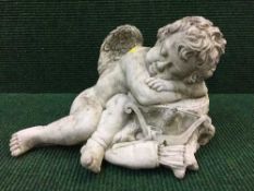 A garden figure - sleeping cherub