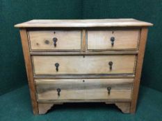 An Edwardian pine four drawer chest