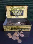 A tin containing a quantity of 1 pence and half pence pieces