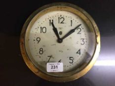 A circular brass cased Smith Sectrick wall clock