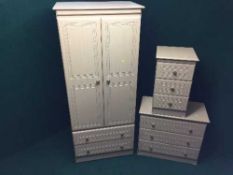 A three piece contemporary beech bedroom suite : double door wardrobe,