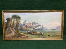 Late nineteenth Century Italian School : Boats in an estuary with a fortified town beyond,