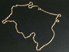 A two-tone twist necklace stamped '750', 11.