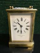 A French striking brass carriage clock, twin barrel movement with platform escapement,