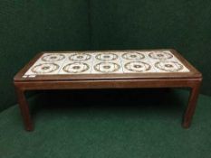 A 1970s G-Plan teak tiled topped coffee table