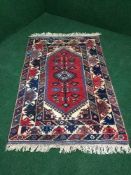 A fringed hand knotted Turkish woolen rug 1.74 m x 1.