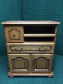 A contemporary oak audio cabinet