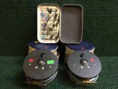 Two Hardy Brothers cased Marquis salmon number 2 fishing reels and a tin of flies