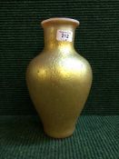 A gold glass Tiffany style vase
