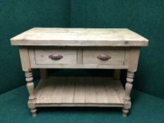A reclaimed pine two drawer side table