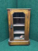A Victorian inlaid mahogany cabinet