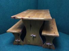 A reclaimed pine kitchen table fitted with two drawers