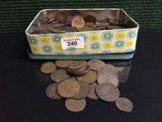 A tin of early twentieth century British pennies etc