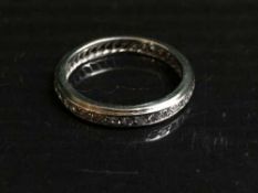 A platinum and diamond set full eternity ring,