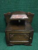 A continental oak bedside cabinet with inset marble panel