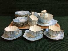 An early 20th century blue floral tea set